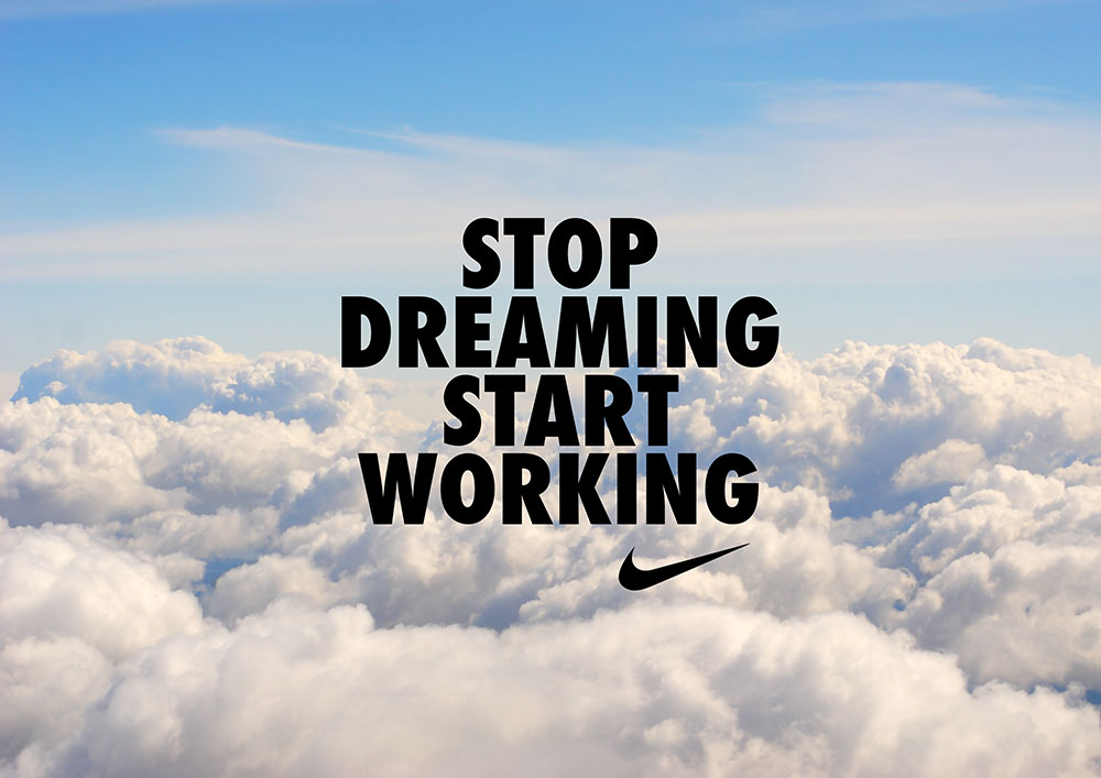 Nike Magazine Ad - "Stop Dreaming Start Working" with Nike logo on clouds