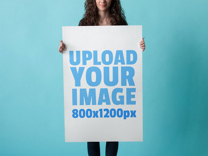 free-woman-holding-poster-mockup-psd-1000x750-700x525 39 Free poster mockup examples to download in PSD format