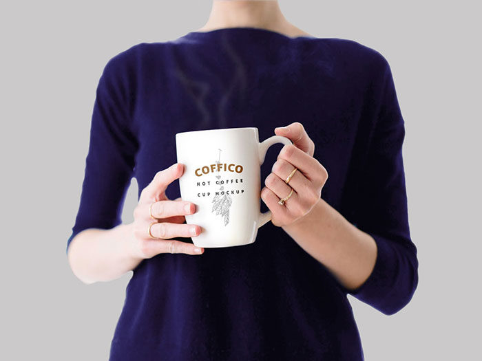 Woman-Holding-Coffee-Mug-700x525 Mug mockup examples to use for presenting your designs
