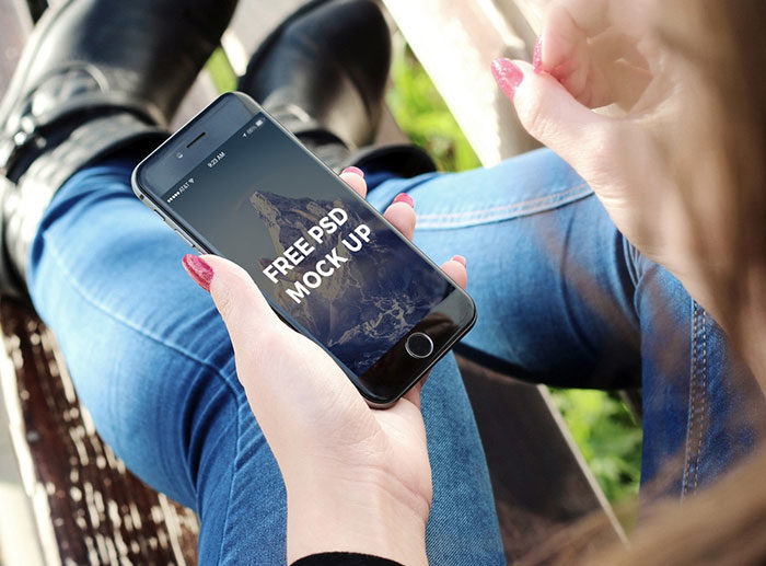 iPhone-in-female-Hand-Mockup-Set-700x517 Hand holding iPhone mockup templates you can download now