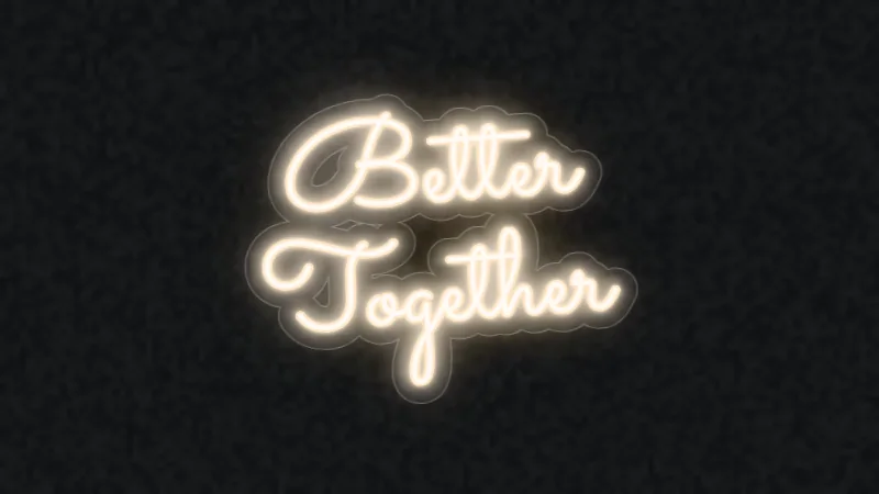 Warm white neon script reading Better Together on a cut-to-shape acrylic backboard