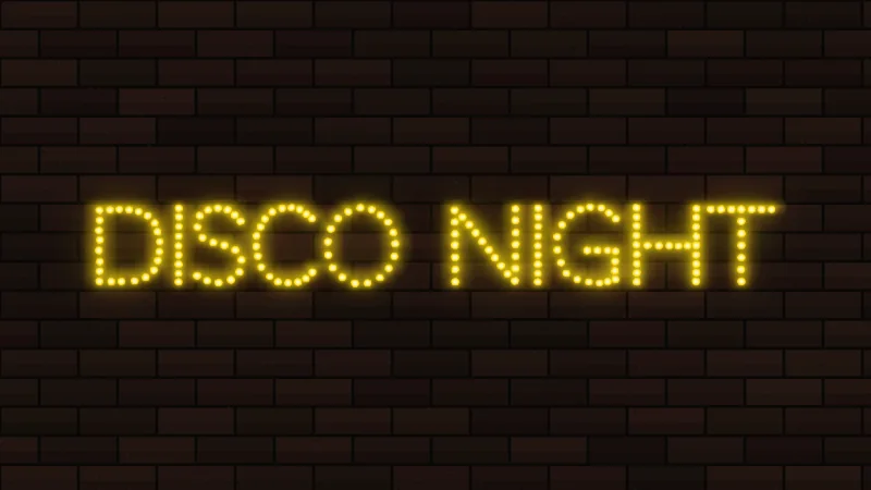 Yellow dotted neon lettering reading Disco Night in an LED marquee style