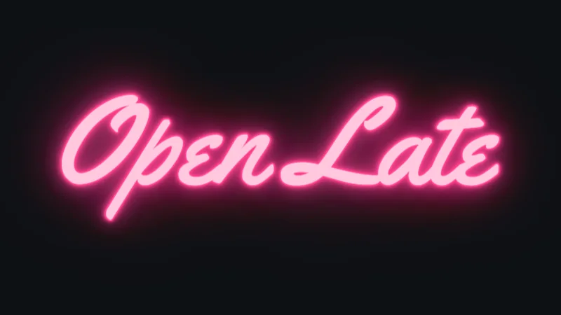 Pink neon sign reading Open Late in a slanted retro script on a dark wall